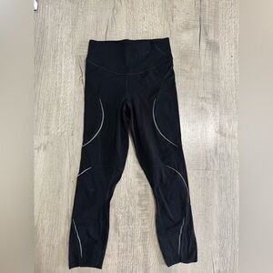 Black Lululemon leggings with silver accents, size 6